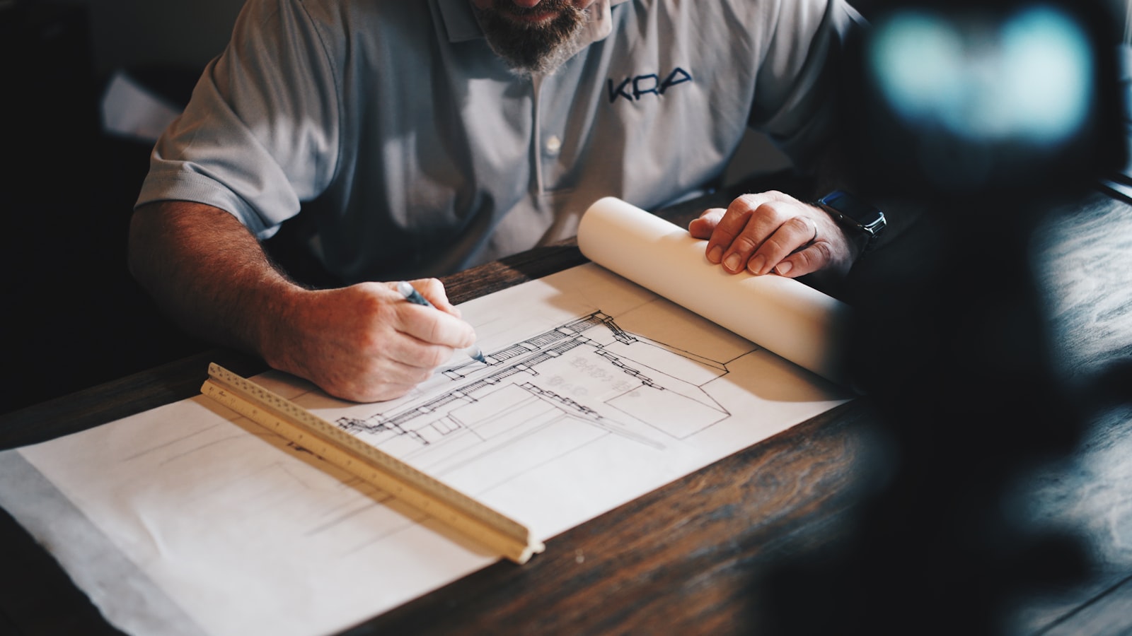Architect reviewing the blueprints of a residential project